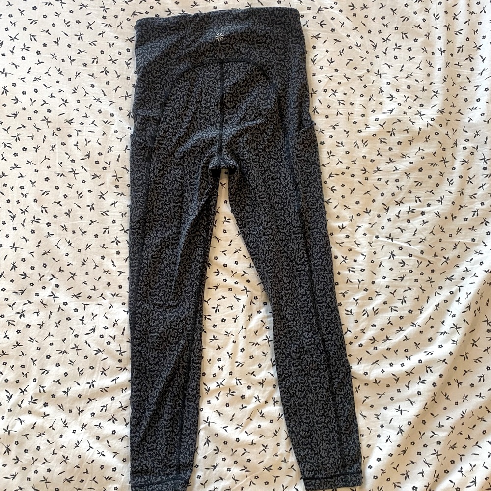 Athleta “Ultimate Stash Pocket 7/8 textured Tight” leggings reflective pattern
